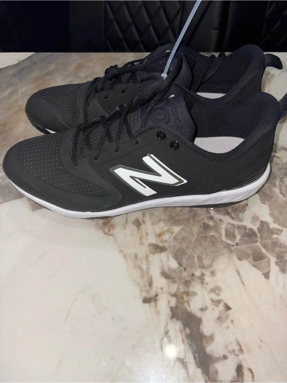 New Balance Men’s Black and White Baseball Cleats with Metal Spikes